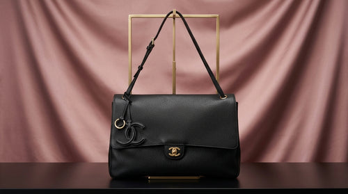CHANEL Black Pebbled Leather Flap Bag with Gold Twist-Lock