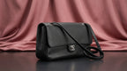 CHANEL Black Pebbled Leather Flap Bag with Turn-Lock Closure