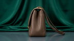 CHANEL Taupe Pebbled Leather Flap Bag with Gold Twist-Lock