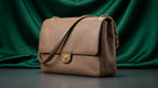 CHANEL Taupe Pebbled Leather Flap Bag with Gold Twist-Lock