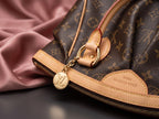 LOUIS VUITTON Canvas Pleated Tivoli Satchel Bag