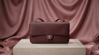 CHANEL Burgundy Pebbled Leather Flap Bag with Silver Twist-Lock
