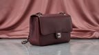 CHANEL Burgundy Pebbled Leather Flap Bag with Silver Twist-Lock