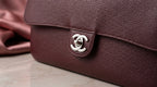 CHANEL Burgundy Pebbled Leather Flap Bag with Silver Twist-Lock
