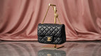 CHANEL Black Quilted Leather Mini Flap Bag with Gold Rosette Chain