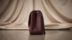 CHANEL Burgundy Pebbled Leather Flap Bag with Silver Twist-Lock